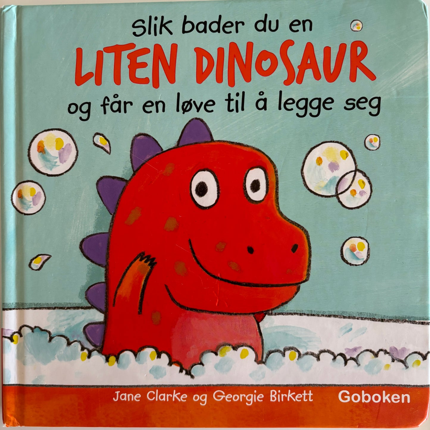 Clarke, Jane: Slik bader du en liten dinosaur, og får en løve til å legge seg